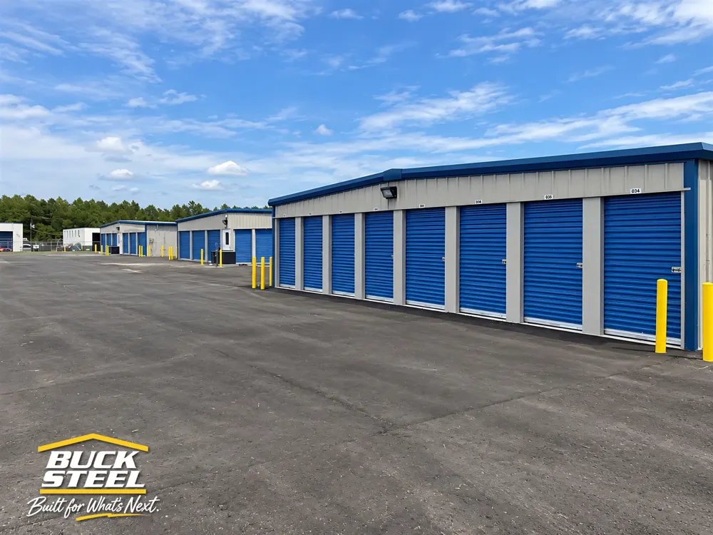 Buck Steel mini storage building with blue rollup doors